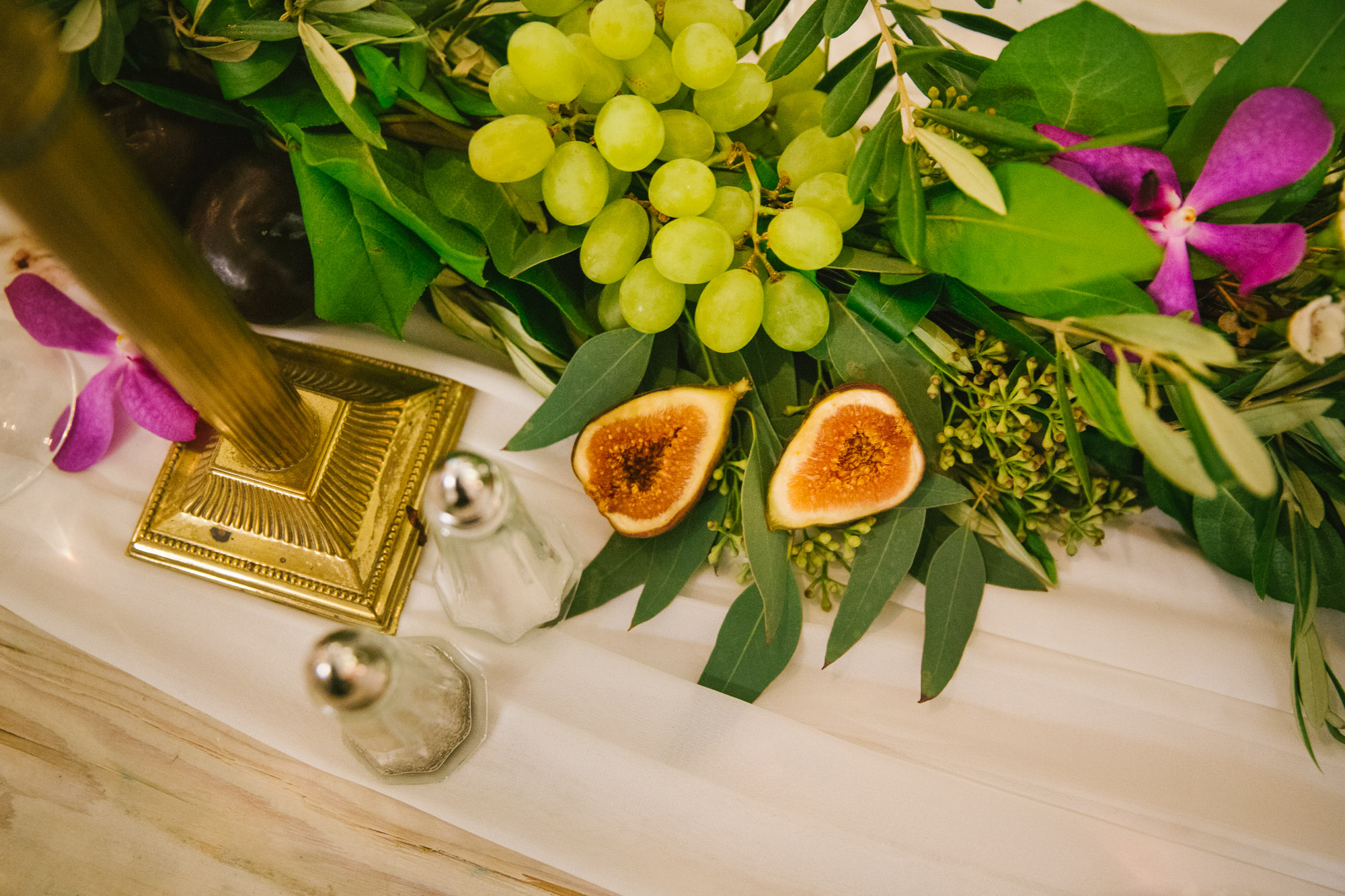 You might want to hire a professional wedding photographer reason 39: Artful photo of gratuitous fresh figs resting among laurels.