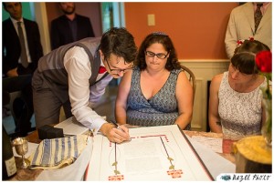 signing the ketubah intimate family home wedding