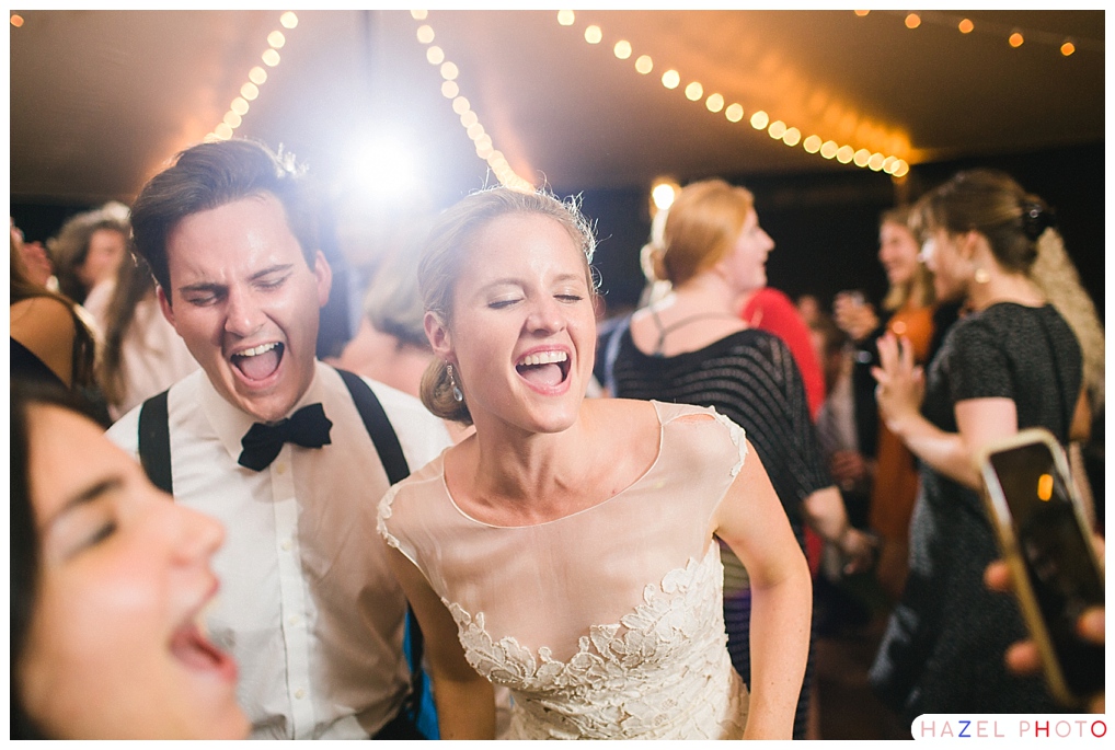 bride and groom with their eyes closed singing along with the band Documentary wedding photography