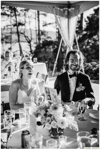 bride and groom laughing at table