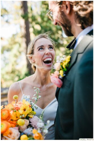 bride smiling looking up at groom