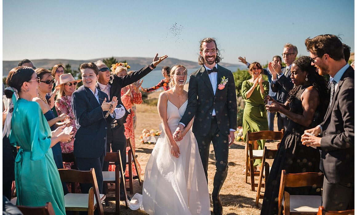 bride and groom during recessional marconi lodge wedding