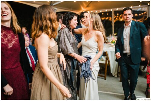 wedding guests embrace