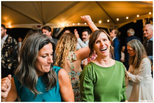 wedding guests dancing and laughing