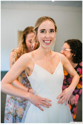 excited bride getting ready at the lodge at marconi