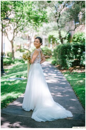 bridal portrait along shady green path