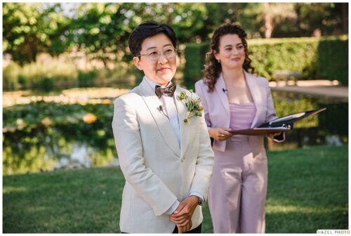partner awaiting their partner walk down the aisle during the ceremony
