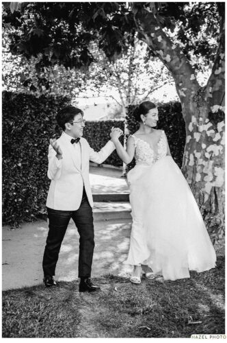 grand entrance of newlyweds, holding hands