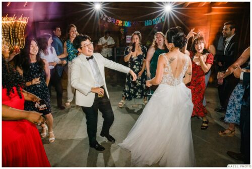 wedding party dancing around couple that got married