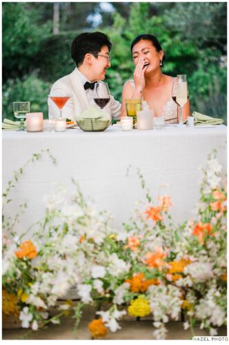 newlyweds cry laughing during the toasts